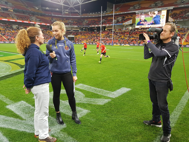 Erin Peterson talks to media about the Virtual Reef Diver project at the Brisbane Broncos game